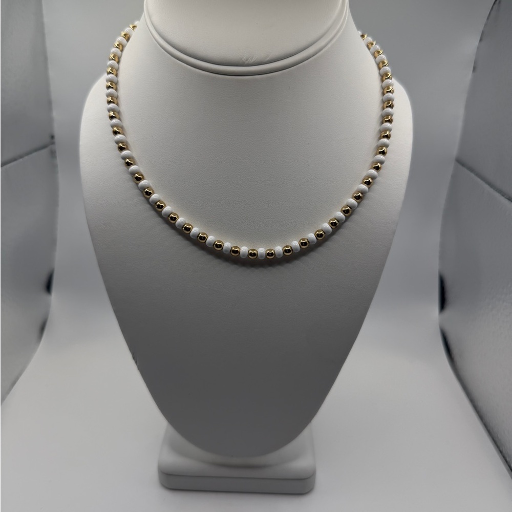 Elegant Gold and White Beaded Necklace